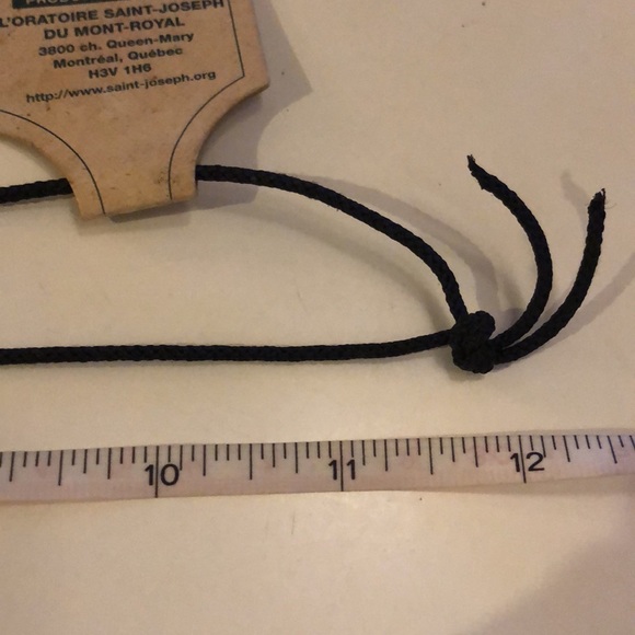 Wood look carved cross on cord - Picture 7 of 7